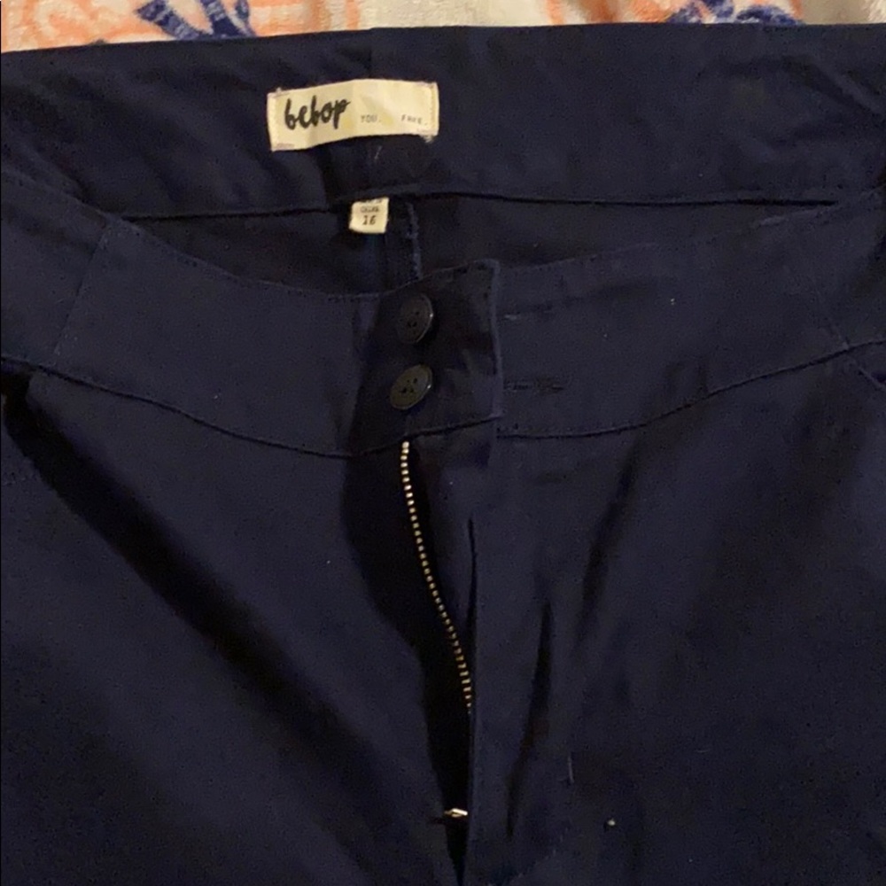 Navy pants. Slight flare at bottom